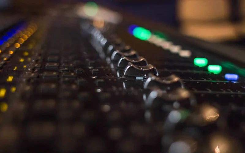 Faders on a mixing desk